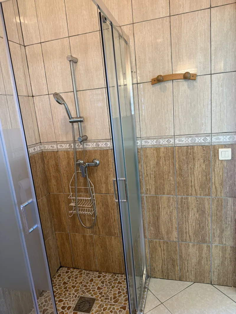 Walk-in shower in the shared bathroom at Villa Bigaradier